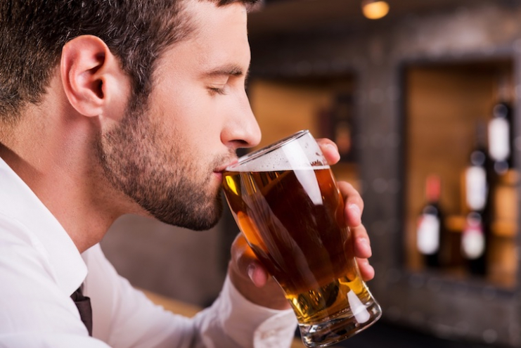 Man-drinks-beer-in-a-bar-in-Switzerland.jpg